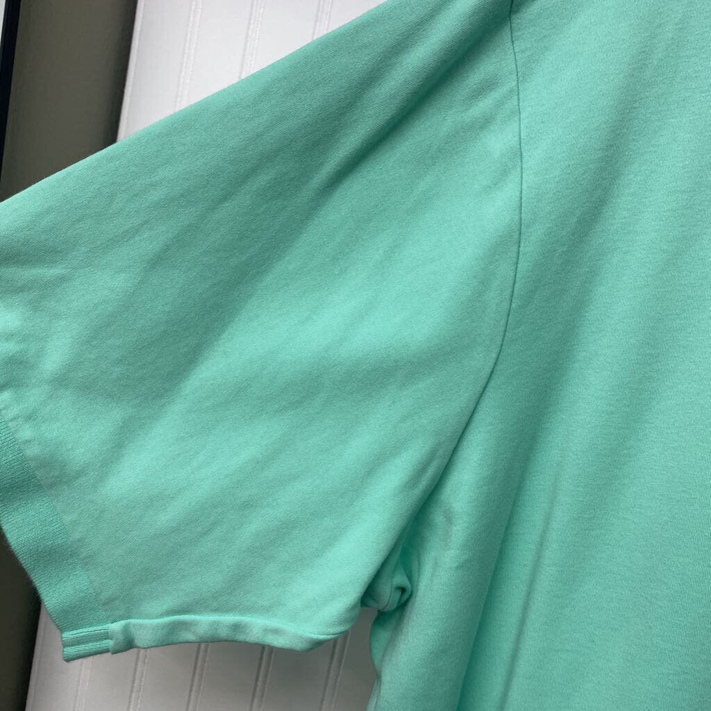 teal polo shirt
