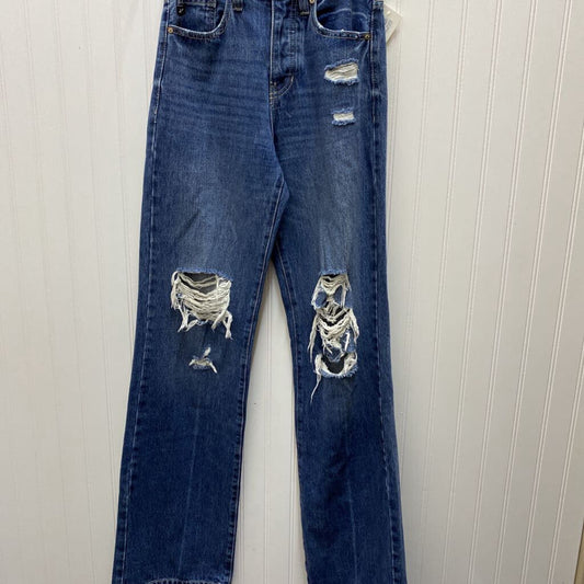 DISTRESSED BUTTON DOWN JEANS